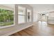 Living room with hardwood floors and large windows offering natural light at 1742 W Saint Louis St, Tampa, FL 33607