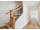 Wooden staircase with black metal accents and hardwood floors at 1742 W Saint Louis St, Tampa, FL 33607