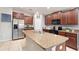 Modern kitchen with granite countertops and stainless steel appliances at 1782 Broad Winged Hawk Dr, Ruskin, FL 33570