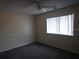 Spacious bedroom with window and ceiling fan at 1820 Bough Ave # 3, Clearwater, FL 33760