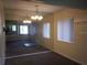 Dining area with mirrored wall reflecting the living room at 1820 Bough Ave # 3, Clearwater, FL 33760