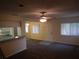 Bright living room with carpet flooring, ceiling fan, and open concept at 1820 Bough Ave # 3, Clearwater, FL 33760