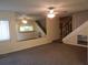 Spacious living room with mirrored wall and carpeted floors at 1820 Bough Ave # 3, Clearwater, FL 33760