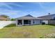 House with screened porch and fenced backyard at 19304 Garden Quilt Cir, Lutz, FL 33558