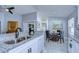 Eat-in kitchen with granite countertops, white cabinets, and breakfast nook at 19304 Garden Quilt Cir, Lutz, FL 33558