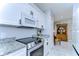 Modern kitchen featuring granite countertops and stainless steel appliances at 19304 Garden Quilt Cir, Lutz, FL 33558