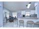 Open kitchen with breakfast bar and granite countertops at 19304 Garden Quilt Cir, Lutz, FL 33558