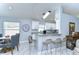 Open kitchen with granite counters and breakfast bar seating at 19304 Garden Quilt Cir, Lutz, FL 33558