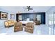 Spacious main bedroom with a king-size bed and sitting area at 19304 Garden Quilt Cir, Lutz, FL 33558