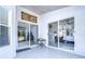 Covered patio with glass doors and access to bedroom at 19304 Garden Quilt Cir, Lutz, FL 33558