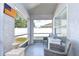 Screened porch with tiled floor and wicker chairs at 19304 Garden Quilt Cir, Lutz, FL 33558