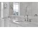 Bathroom boasts a double vanity with marble countertop at 200 Cordova Ne Blvd, St Petersburg, FL 33704