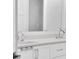 Modern bathroom with double vanity and large mirror at 200 Cordova Ne Blvd, St Petersburg, FL 33704