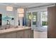 Living room with sliding doors opening to backyard oasis at 200 Cordova Ne Blvd, St Petersburg, FL 33704