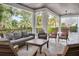 Covered patio with comfortable seating and beautiful landscaping at 200 Cordova Ne Blvd, St Petersburg, FL 33704