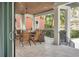 Relaxing covered patio with seating area and wood ceiling at 200 Cordova Ne Blvd, St Petersburg, FL 33704