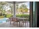 Patio with table and chairs, offering a view of the pool at 200 Cordova Ne Blvd, St Petersburg, FL 33704