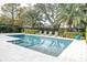 Inviting pool with spa and lounge chairs, surrounded by lush landscaping at 200 Cordova Ne Blvd, St Petersburg, FL 33704