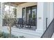 Relaxing porch with rocking chairs and wrought-iron railings at 200 Cordova Ne Blvd, St Petersburg, FL 33704