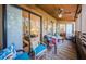 Relaxing balcony with outdoor furniture and view of lush greenery at 204 Lennox W Rd, Palm Harbor, FL 34683