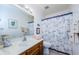 Bathroom with a nautical themed shower curtain at 204 Lennox W Rd, Palm Harbor, FL 34683