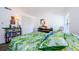 Bedroom with a queen size bed and built-in shelving at 204 Lennox W Rd, Palm Harbor, FL 34683