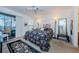 Bedroom with a queen-size bed and access to balcony at 204 Lennox W Rd, Palm Harbor, FL 34683