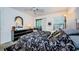 Main bedroom with a queen bed and access to a private balcony at 204 Lennox W Rd, Palm Harbor, FL 34683
