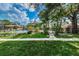 Community features a tennis court, pool, and lush landscaping at 204 Lennox W Rd, Palm Harbor, FL 34683