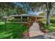 Community building with landscaped walkway at 204 Lennox W Rd, Palm Harbor, FL 34683