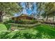Community building with manicured landscaping at 204 Lennox W Rd, Palm Harbor, FL 34683