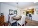 Dining area with a view of the kitchen and breakfast bar at 204 Lennox W Rd, Palm Harbor, FL 34683