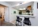 Galley style kitchen with dark wood cabinets and breakfast bar at 204 Lennox W Rd, Palm Harbor, FL 34683