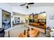 Open concept living room with a large cabinet and hardwood floors at 204 Lennox W Rd, Palm Harbor, FL 34683