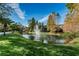 Serene pond with a water fountain in the Glen Eagles community at 204 Lennox W Rd, Palm Harbor, FL 34683