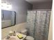 Clean bathroom with a shower/tub combo and updated fixtures at 2285 Israeli Dr # 1, Clearwater, FL 33763