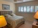 Bright bedroom featuring a queen-size bed and ample natural light at 2285 Israeli Dr # 1, Clearwater, FL 33763