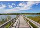 Wooden dock extending over calm lake water at 2285 Israeli Dr # 1, Clearwater, FL 33763