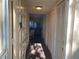 Bright entryway with coat closet and view into the living area at 2285 Israeli Dr # 1, Clearwater, FL 33763