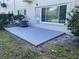 Private patio with a freshly coated concrete surface at 2285 Israeli Dr # 1, Clearwater, FL 33763