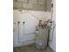 Mechanical room with water heater and plumbing at 263 85Th N Ave, St Petersburg, FL 33702