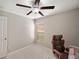 Bedroom with chair and ceiling fan at 333 Argyll Dr, Spring Hill, FL 34609