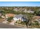 Aerial view of a single-Gathering home in a residential neighborhood near the ocean at 3457 Foxhall Dr, Holiday, FL 34691