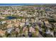 Aerial view of a residential neighborhood with houses near the ocean at 3457 Foxhall Dr, Holiday, FL 34691