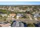 Aerial view of a single Gathering home in a quiet residential neighborhood at 3457 Foxhall Dr, Holiday, FL 34691