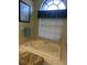 Bathroom with soaking tub and window at 3457 Foxhall Dr, Holiday, FL 34691