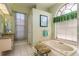 Bathroom boasts a relaxing bathtub and granite vanity at 3457 Foxhall Dr, Holiday, FL 34691
