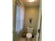 Small bathroom with toilet and window at 3457 Foxhall Dr, Holiday, FL 34691