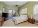 Main bedroom with pool view and stylish decor at 3457 Foxhall Dr, Holiday, FL 34691