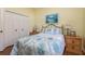 Bright guest bedroom with wood floors and ample closet space at 3457 Foxhall Dr, Holiday, FL 34691